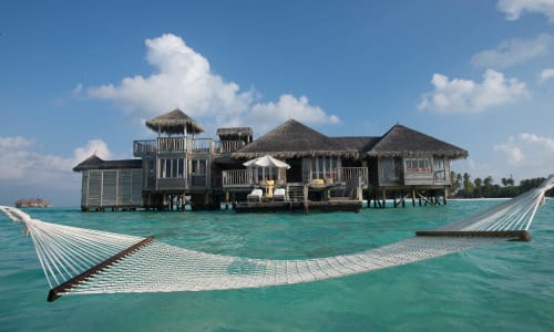 Overwater villa or beach bungalow Maldives